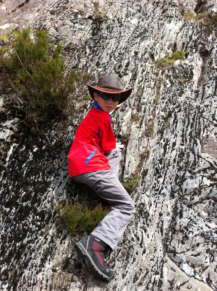 Declan climbs the glaciated walls at Loch Katrine